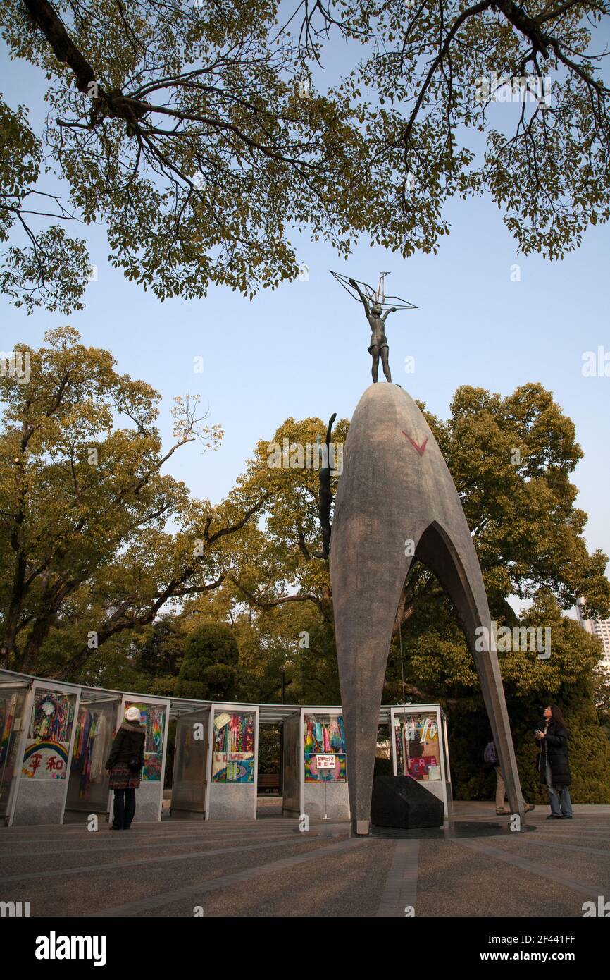 The Children's Peace Memorial Monument surmounted by statue of Sadako Sasaki, Hiroshima Peace Memorial Park, Japan Stock Photo