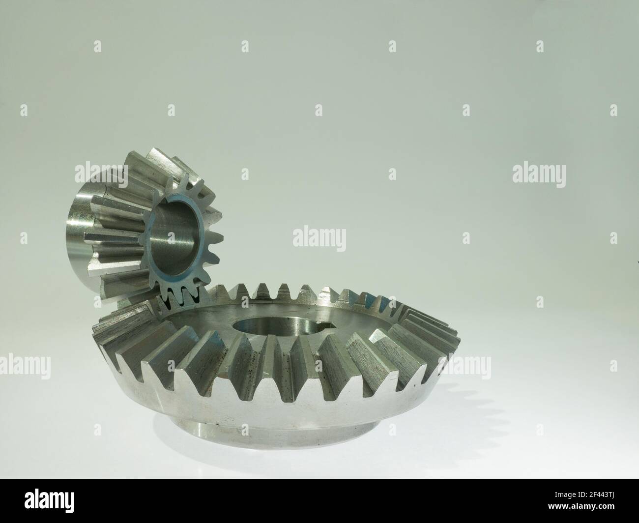 bevel gears: cone-shaped gear which transmits power between two intersecting axes (copy space) Stock Photo