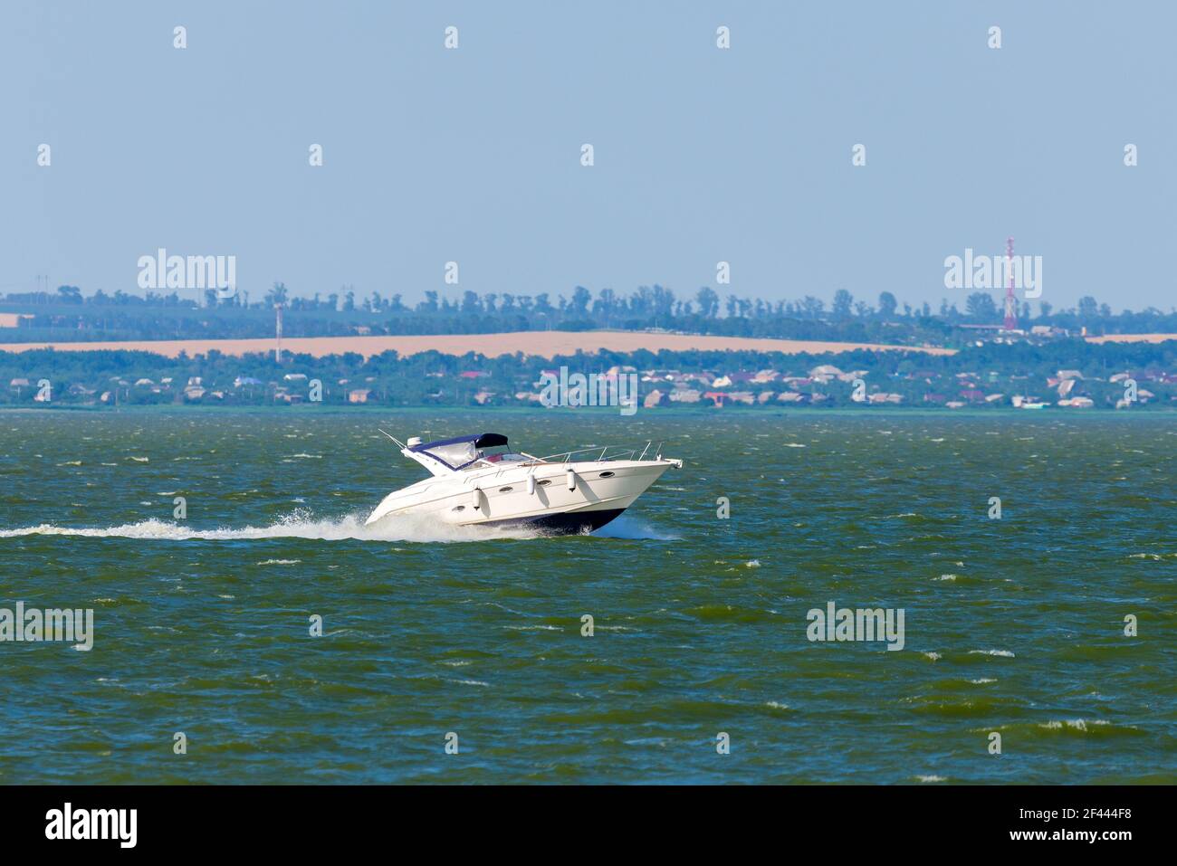 Power speedboat cruising in the sea bay Stock Photo - Alamy