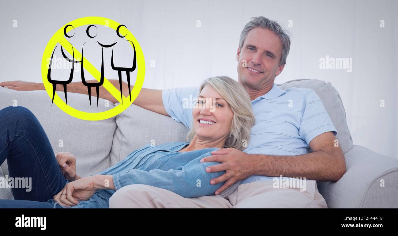 Illustration of social distancing sign portrait of smiling couple at home n background Stock Photo