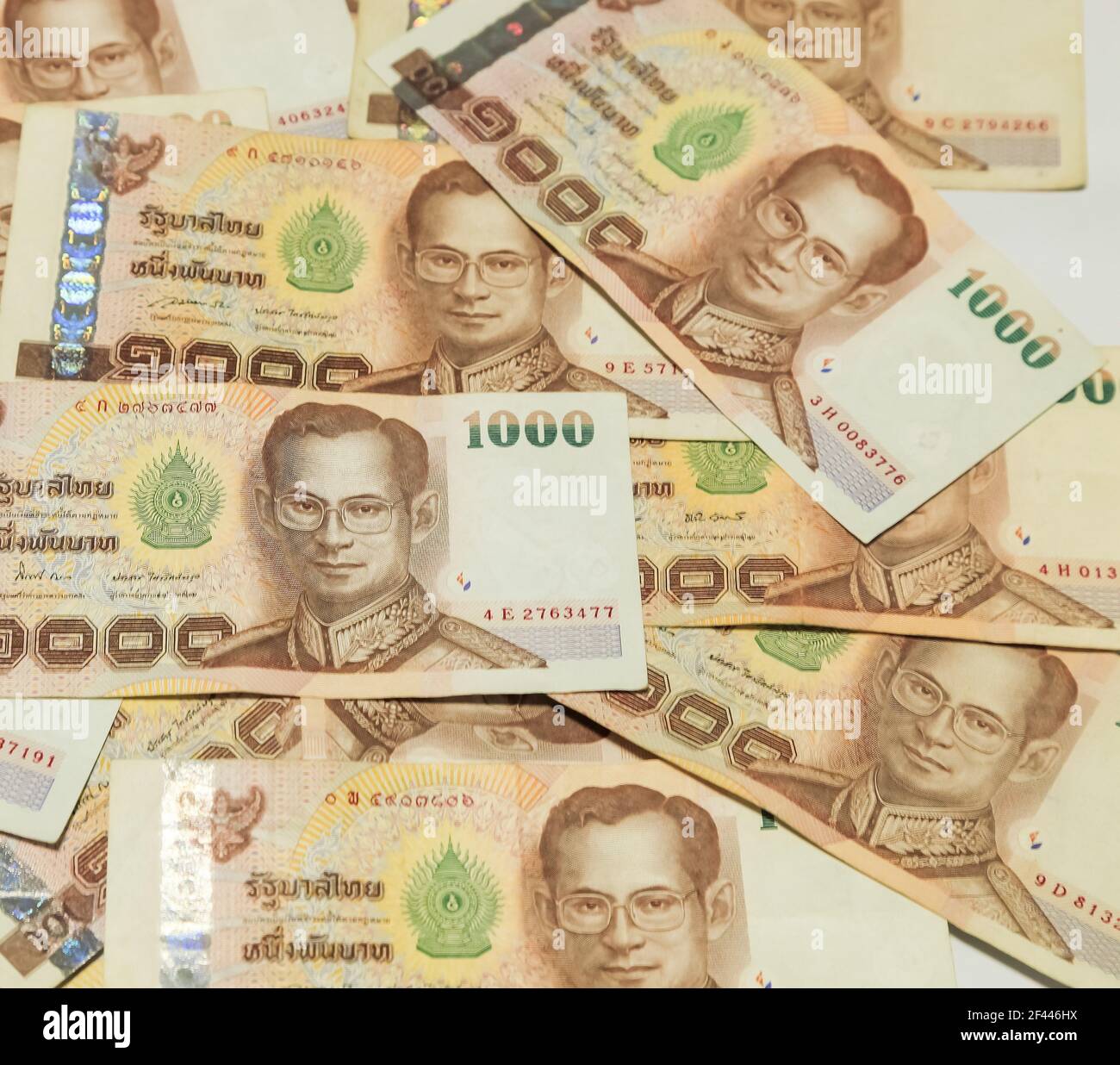 stack of Thai money banknotes baht on white background Stock Photo