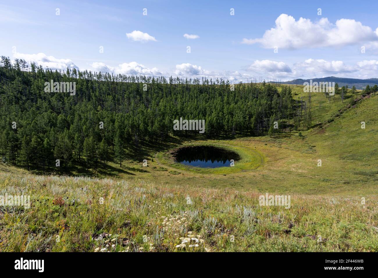 The Uran Togoo and Tulga Volcano with small lake in the steppe of Mongolia in Uran Togoo Natural Monument. Stock Photo