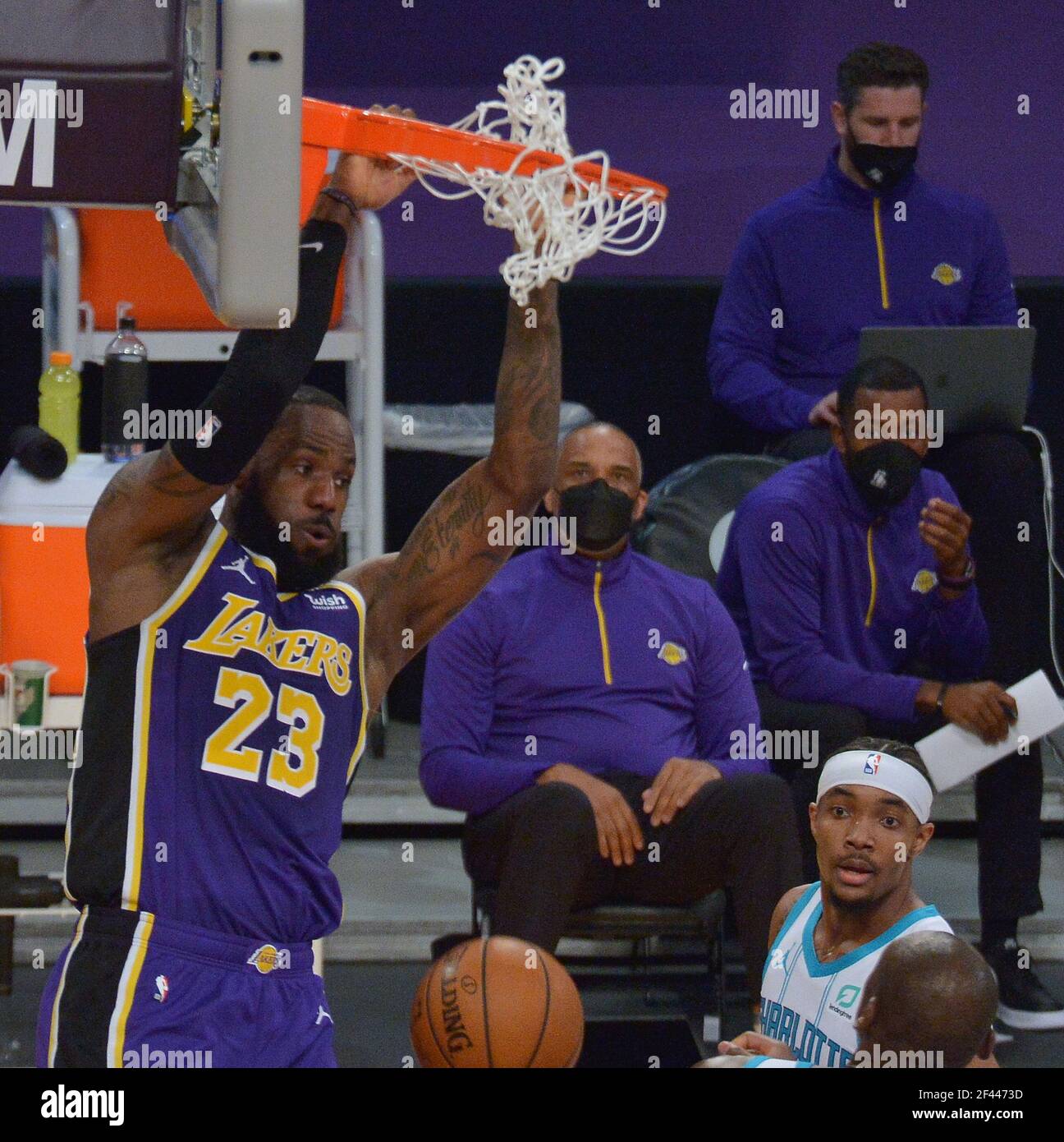 Los Angeles, United States. 18th Mar, 2021. Los Angeles Lakers' forward LeBron James jams for two of his 37-points on Charlotte Hornets' guard Devonte Graham during the first half at Staples Center in Los Angeles on Thursday, March 18, 2021. The Lakers defeated the Hornets 116-105. Photo by Jim Ruymen/UPI Credit: UPI/Alamy Live News Credit: UPI/Alamy Live News Stock Photo