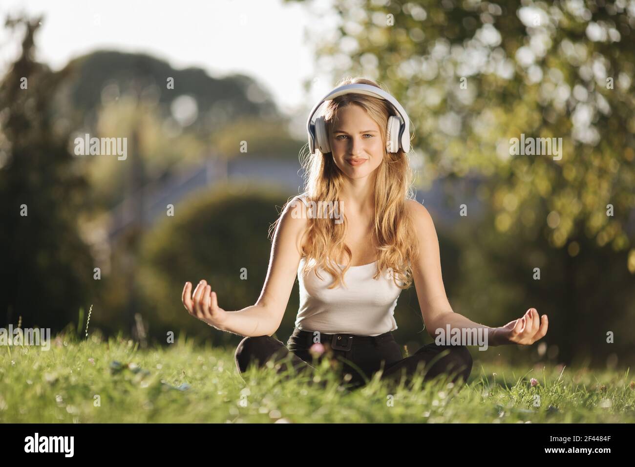 Woman relaxing park headphones hi-res stock photography and images - Alamy
