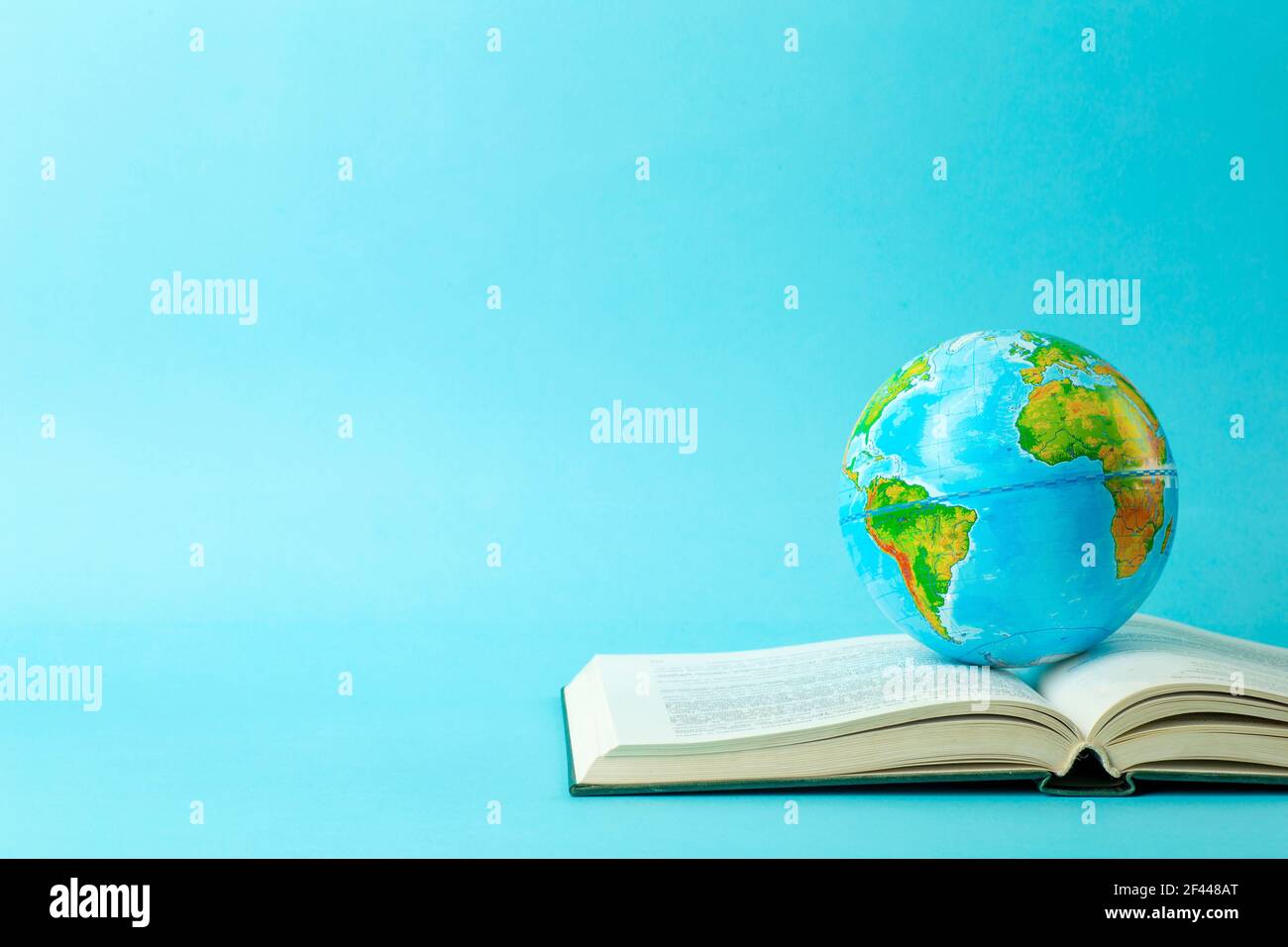 Earth globe on an open book on a blue banner background. Knowledge,  learning, study concept. Background education. High quality photo Stock  Photo - Alamy