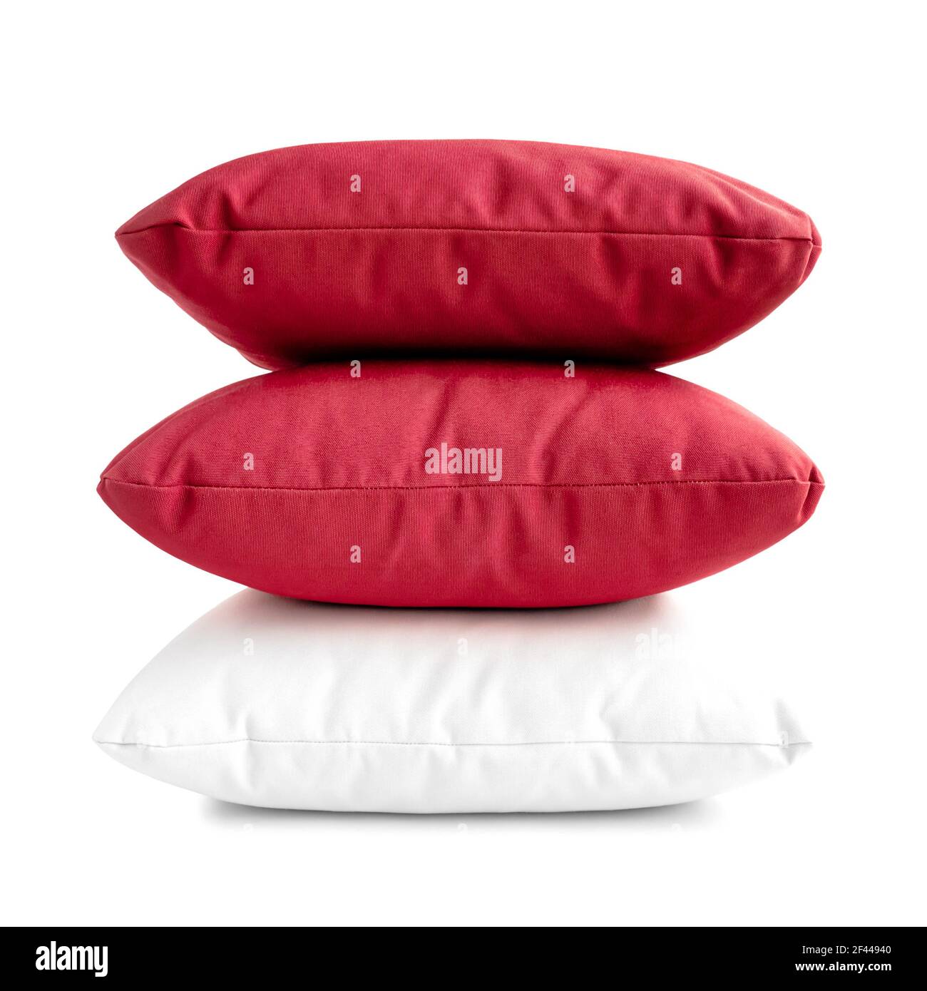 Stack of three cushions or pillows isolated on white background Stock Photo