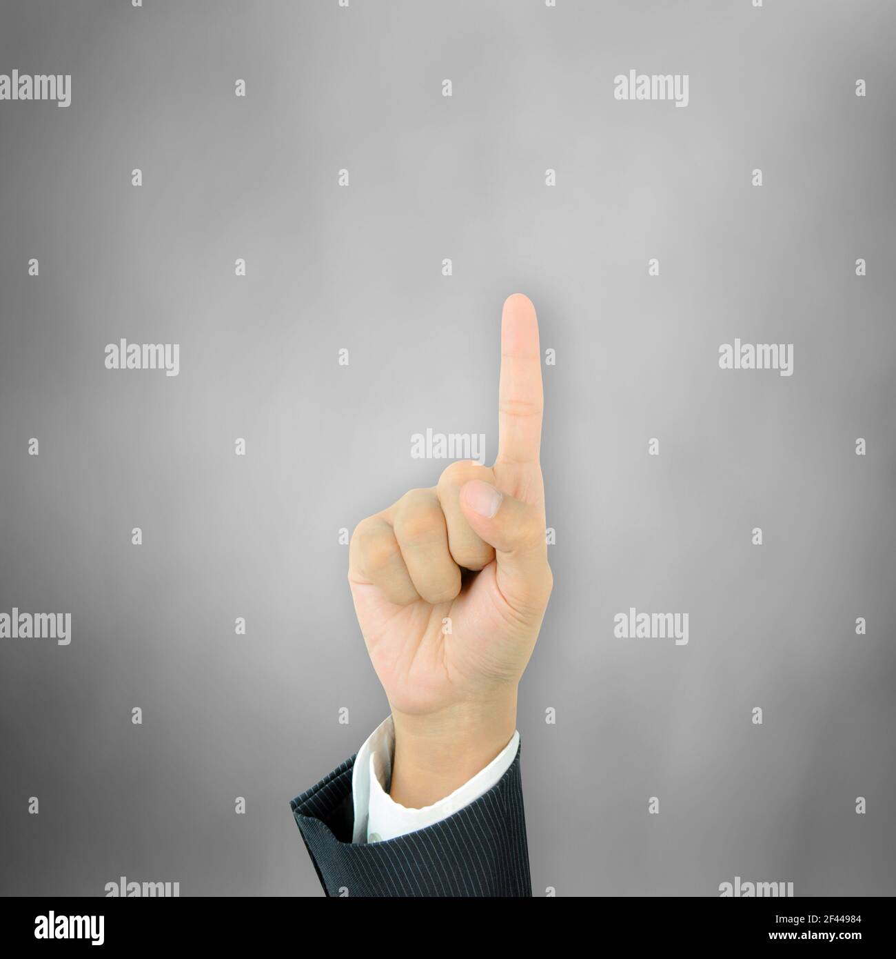 Hand pointing up with index finger Stock Photo