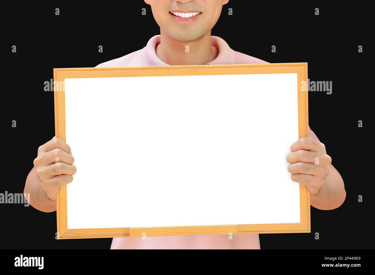 Smiling man holding empty whiteboard - can fill your texts & used as placard, notice & advertising boards etc. Stock Photo