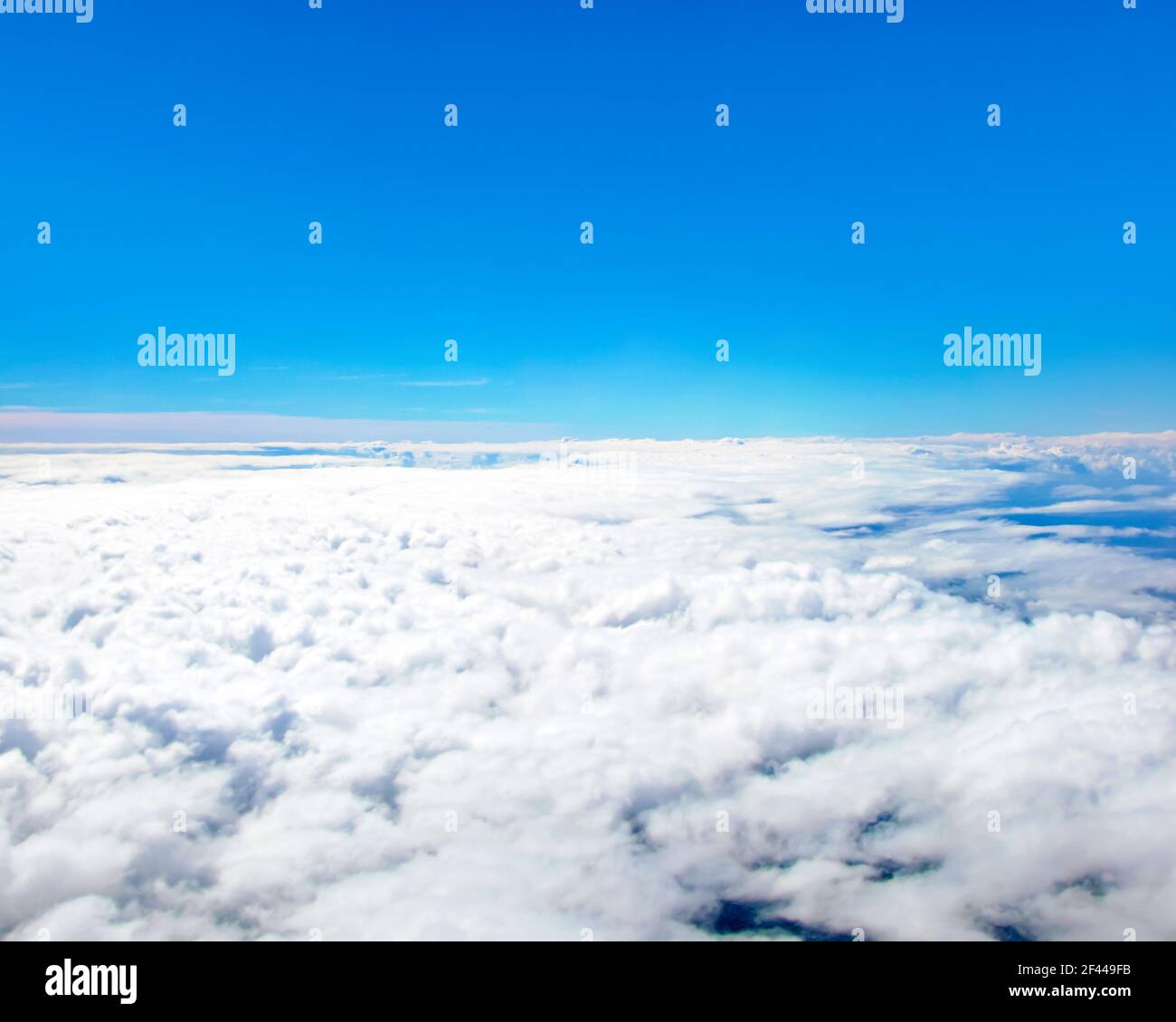 View of blue sky above clouds Stock Photo