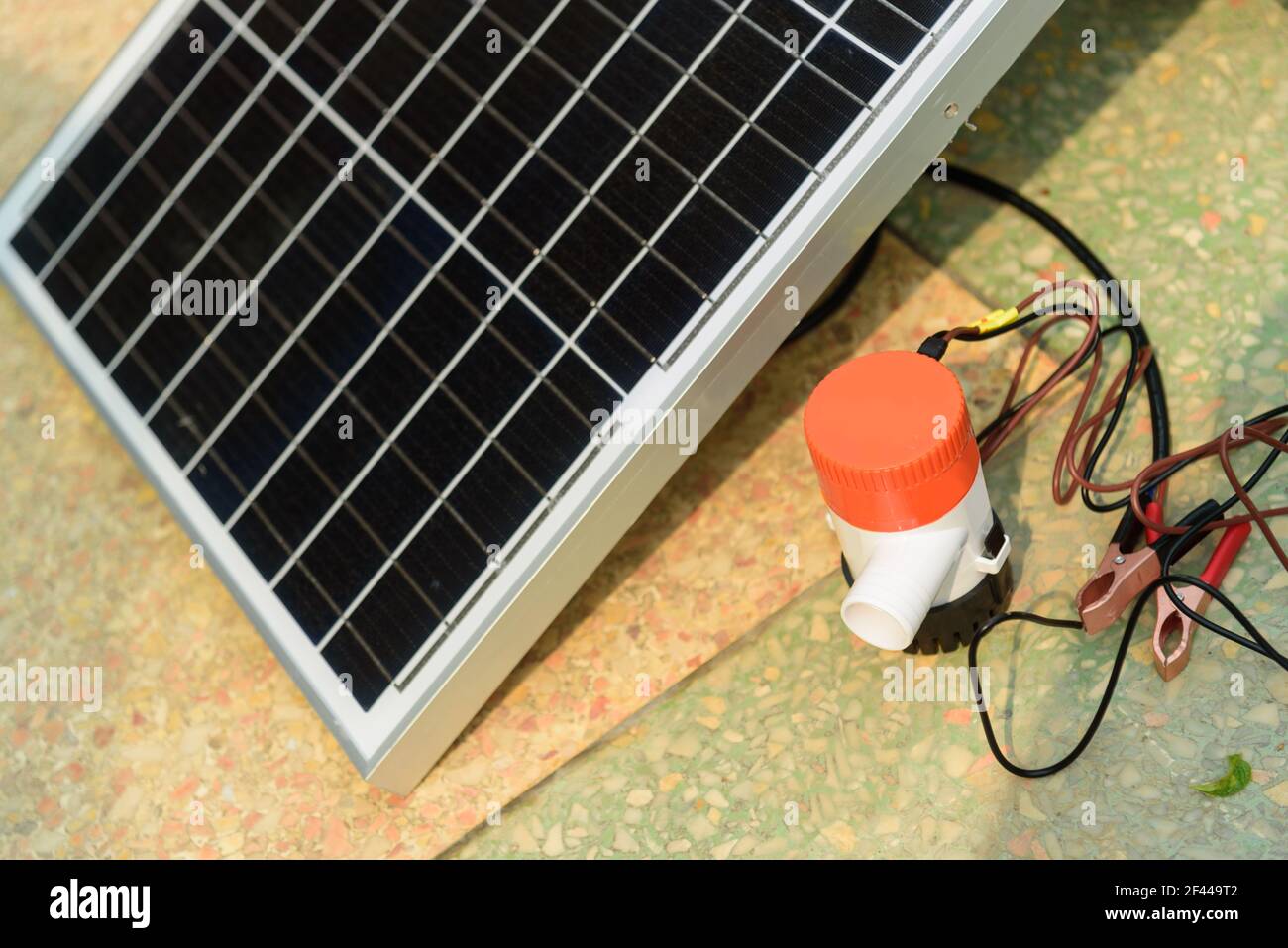 Testing bilge pump connected to use power from solar cell panel Stock Photo