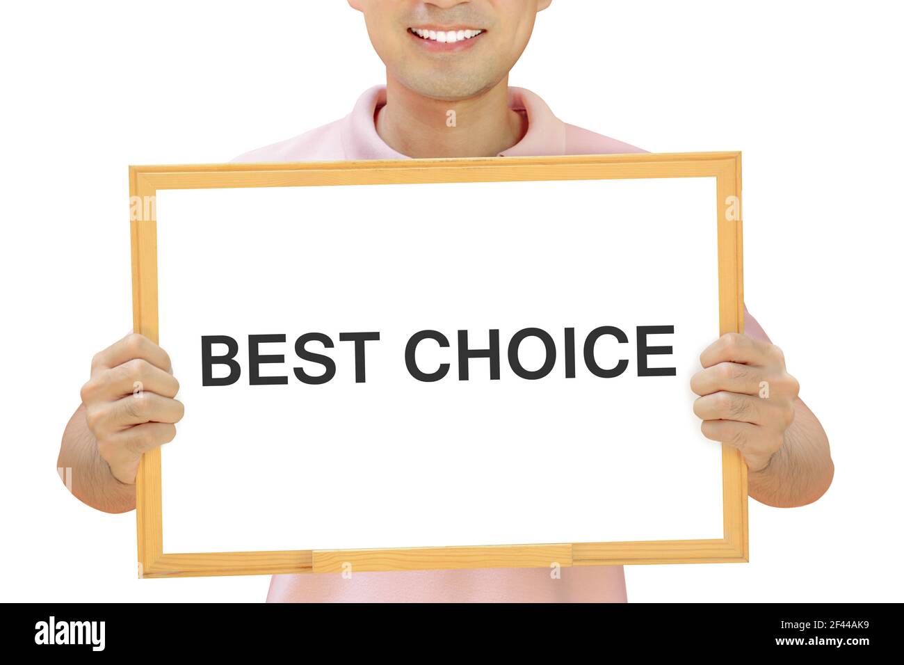 BEST CHOICE text on whiteboard held by smiling man Stock Photo