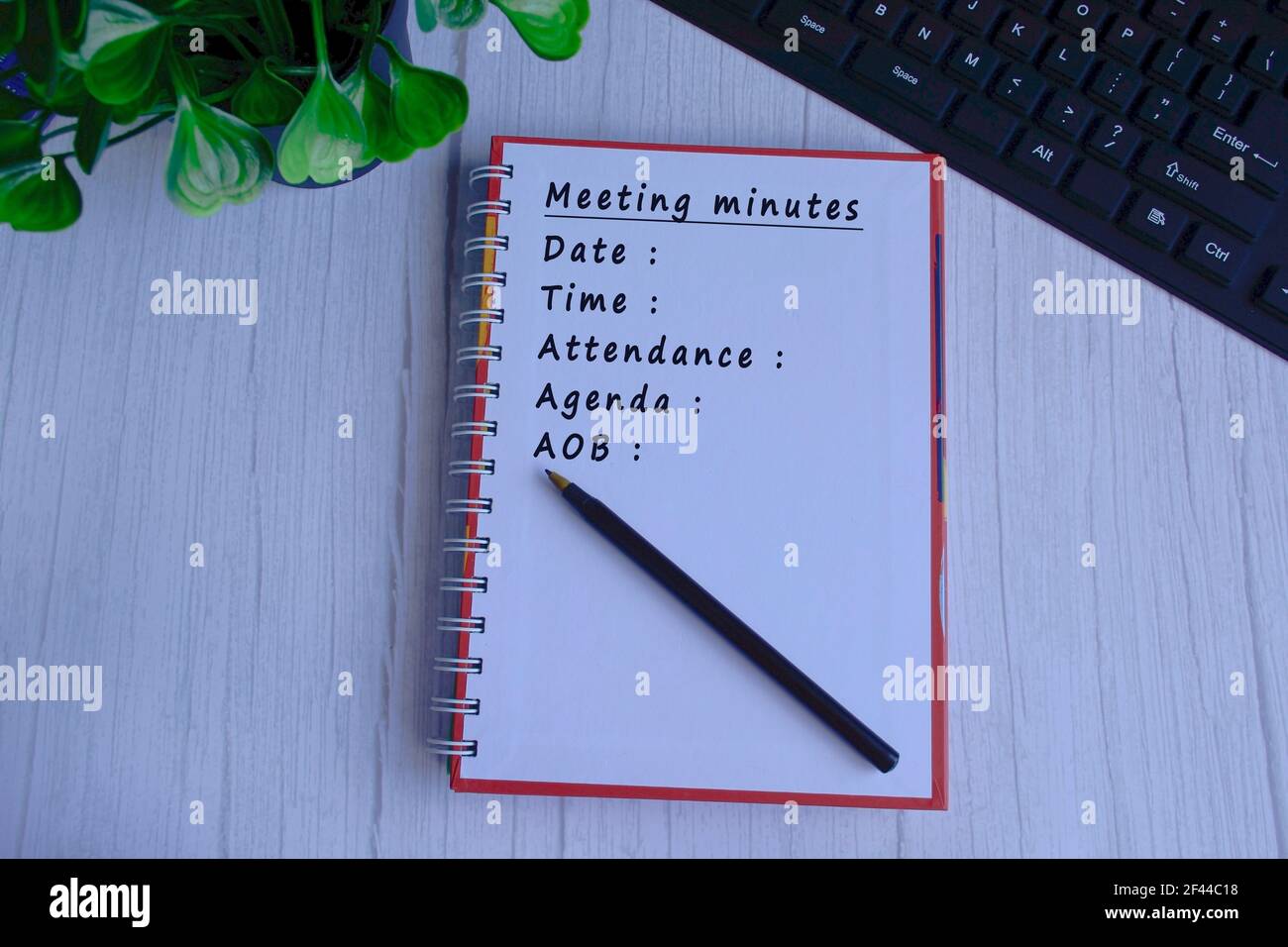 Meeting minutes list text written on notepad. Meeting Concept Stock Photo