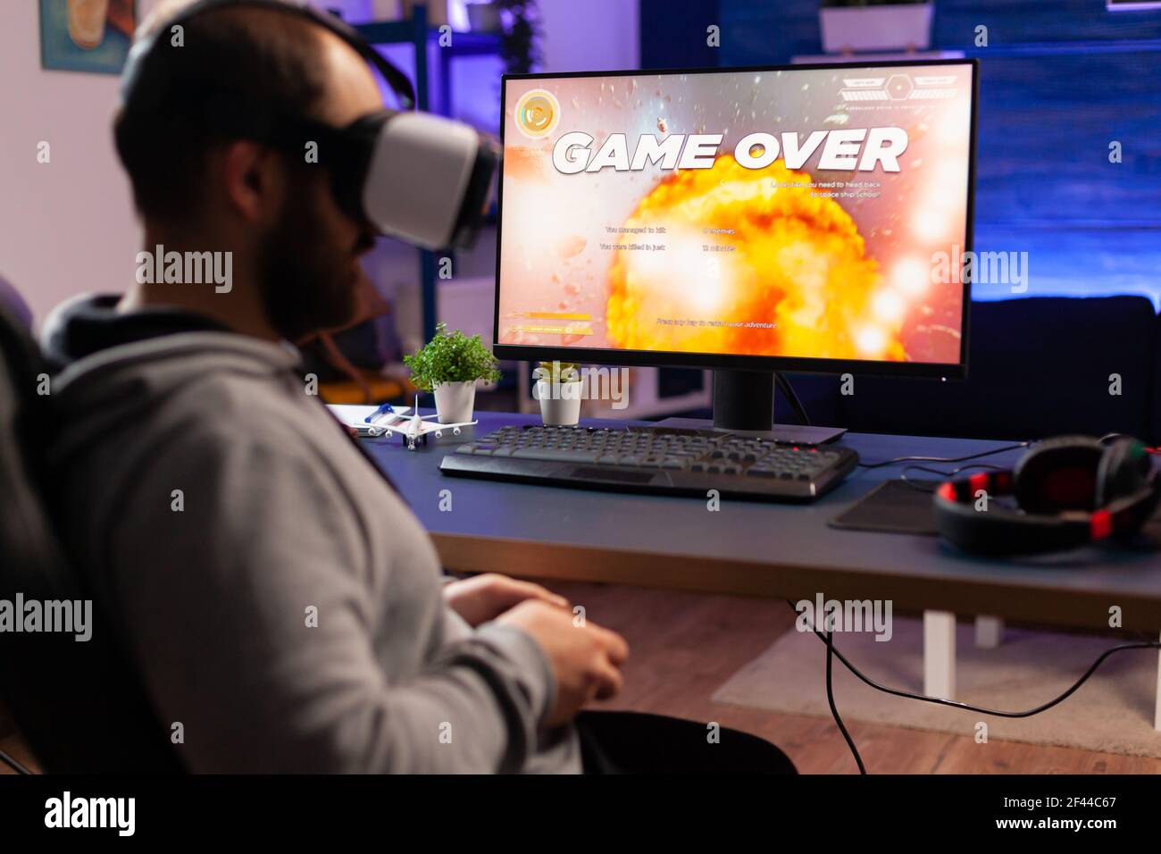 Young girl playing video games on computer after online school and  homework. Gamer using shooting action play for entertainment and fun with  keyboard and monitor. Child enjoying game Stock Photo - Alamy