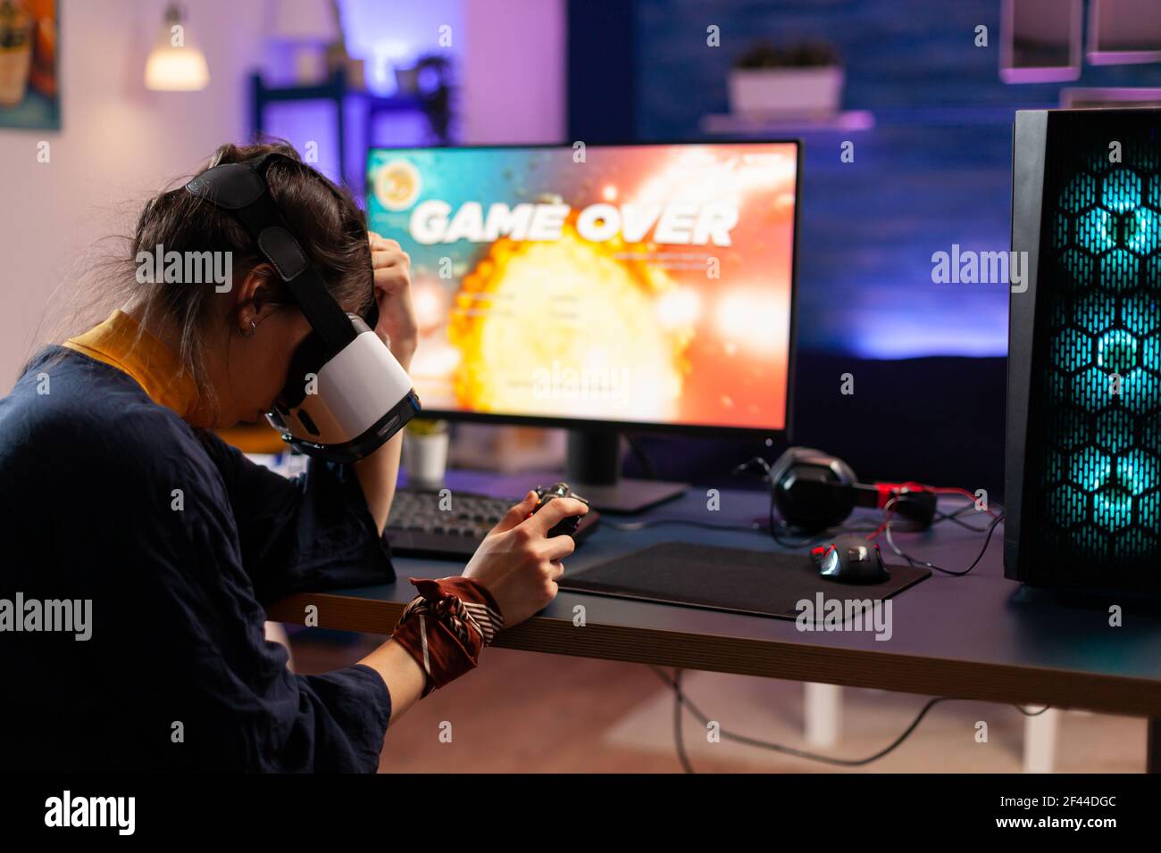 Gamer using controller to play online video games on computer. Man playing  game with joystick and headphones in front of monitor. Player having gaming  equipment, doing fun activity Stock Photo - Alamy