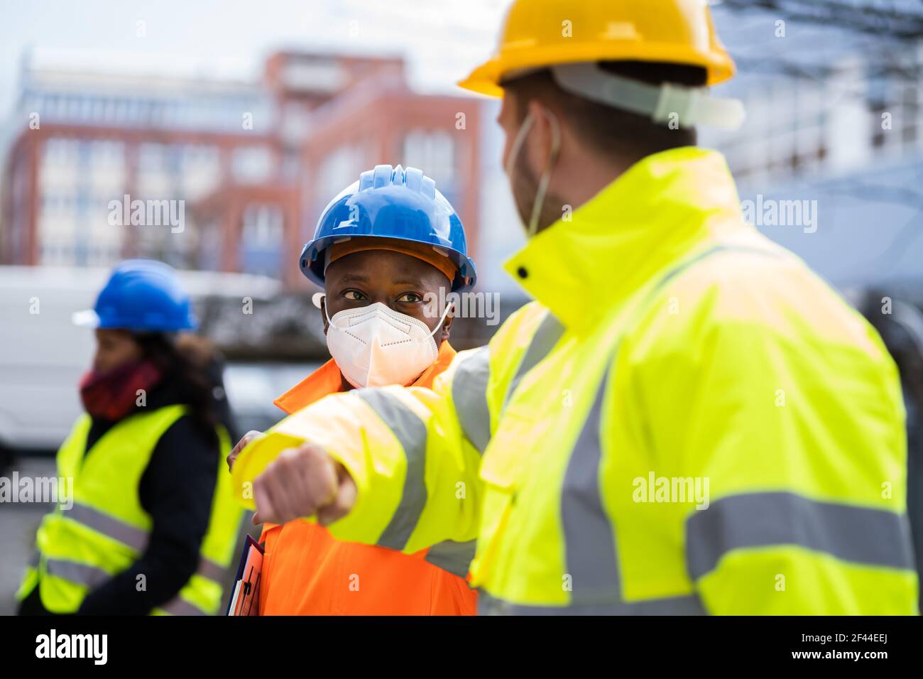 Construction Industry People Teamwork Elbow Bump Greeting Stock Photo