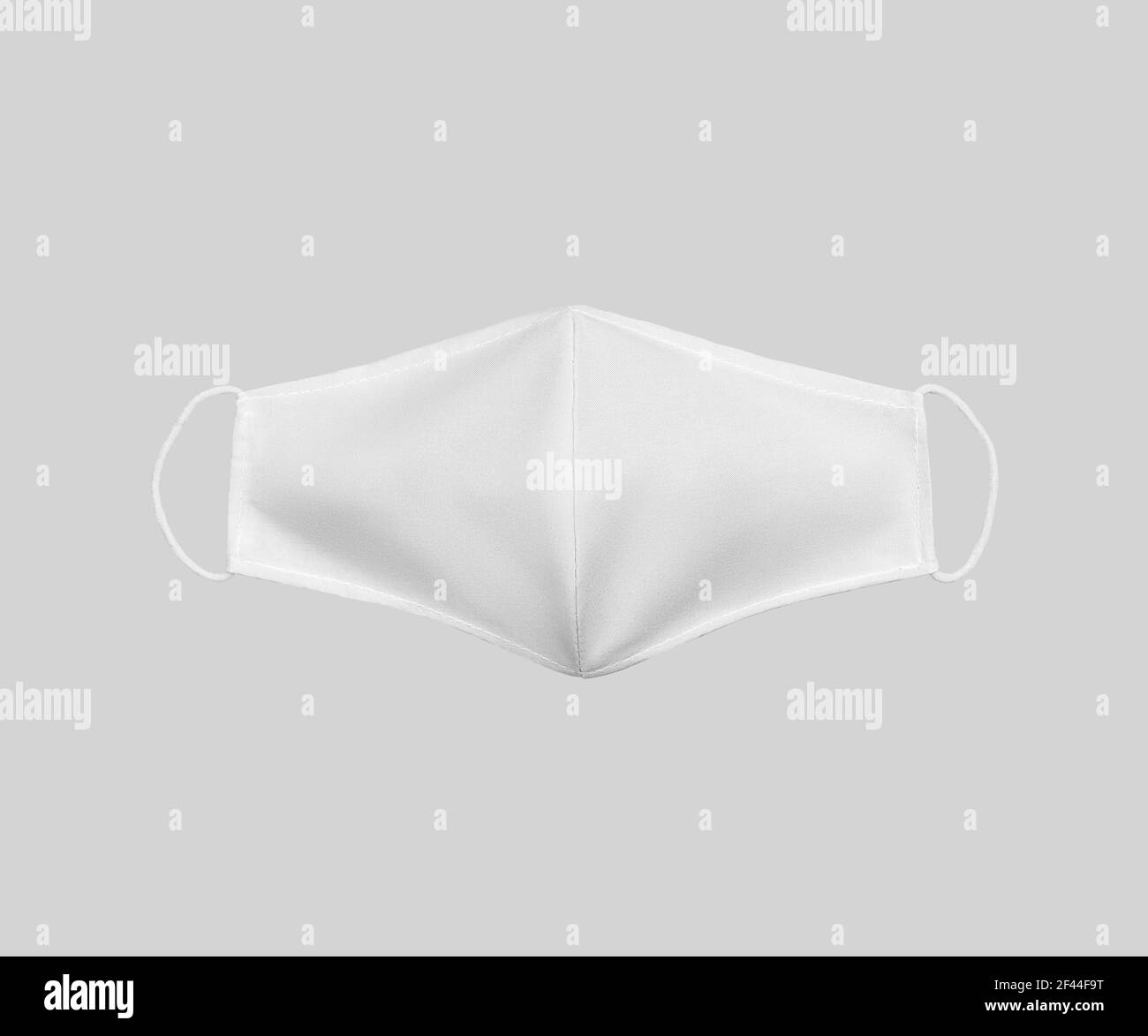 Mockup of a white medical mask, protection against viruses,infections, isolated on background.Texture mask template with place for text,for design pre Stock Photo