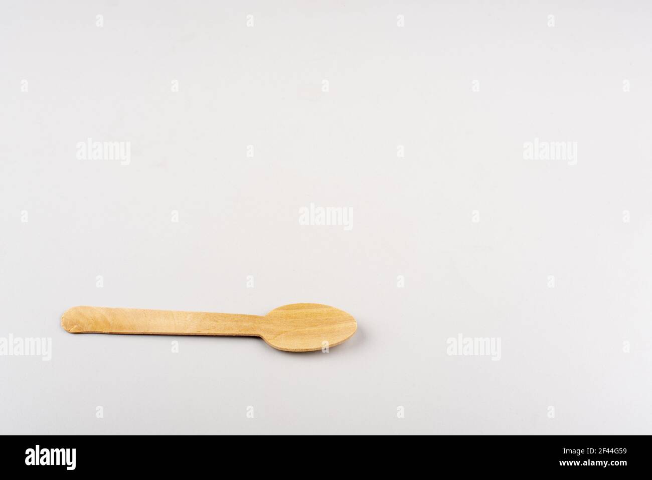 A wooden spoon on white background Stock Photo - Alamy