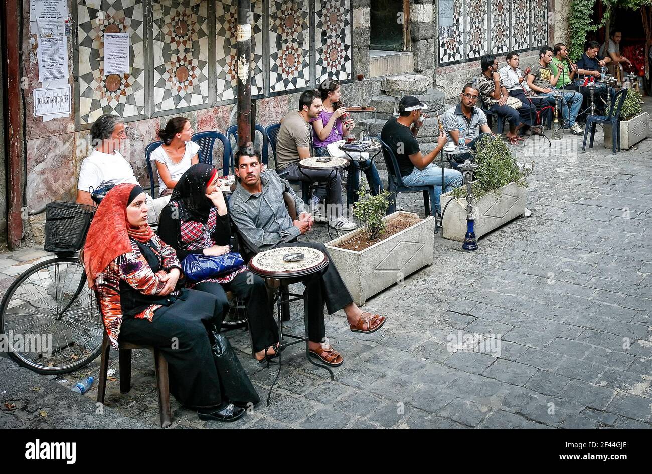Damascus,Syria - August 03,2010 : People smoking shisha in a cafe in Damascus. Stock Photo