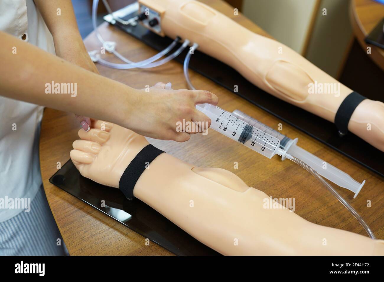 Practical lesson in medicine. workshop medical lessons. Intravenous injection training. Intravenous injection on the mold Stock Photo