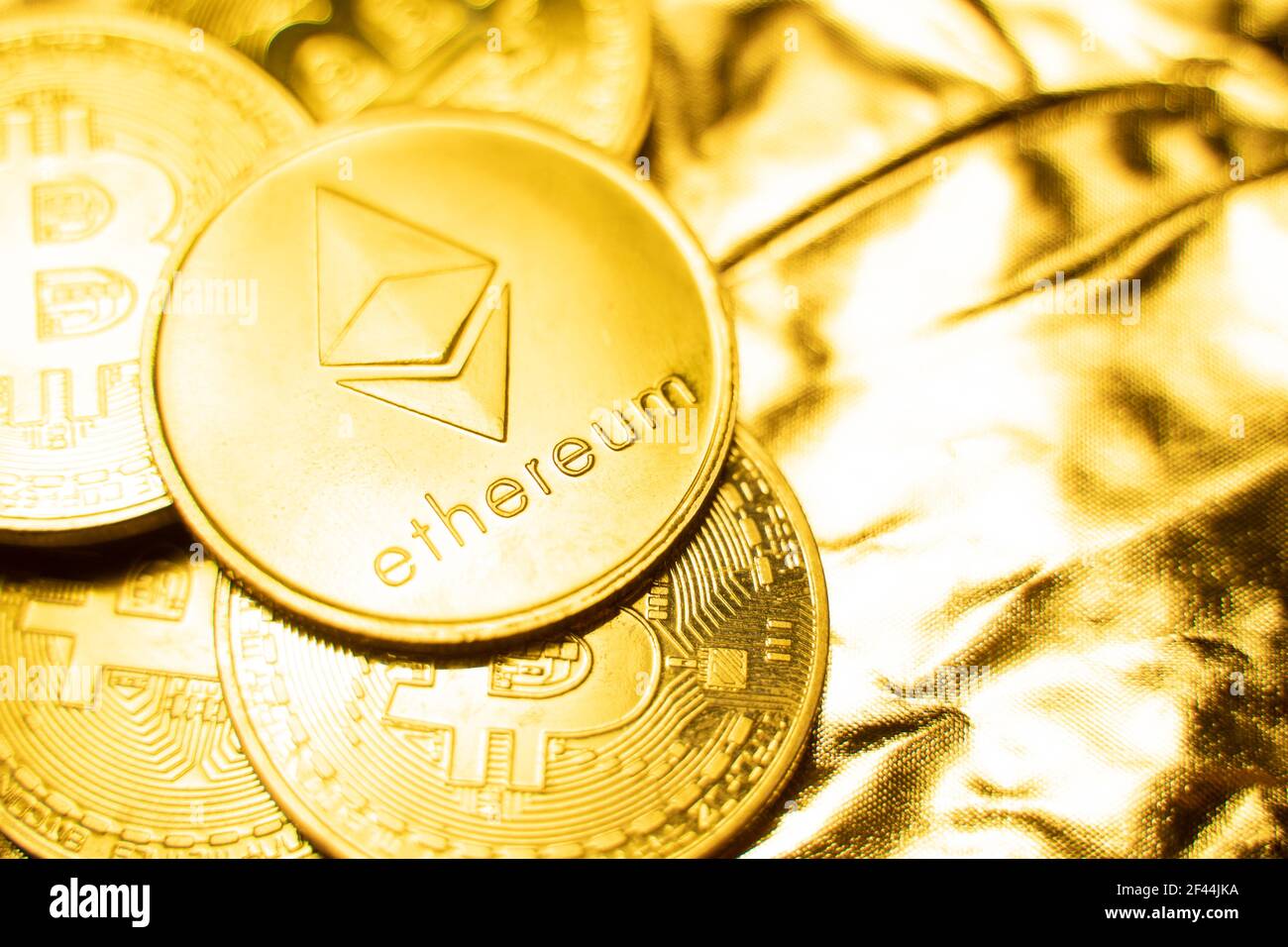 Gold ethereum coins on a golden background. Trading on the cryptocurrency  exchange. Cryptocurrency Stock Market Concept. Virtual money concept. Mining  Stock Photo - Alamy