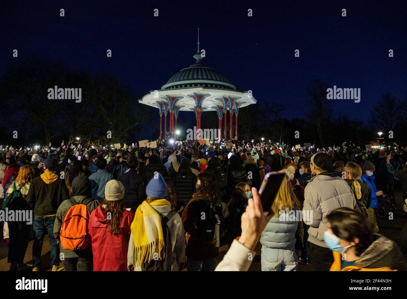 London, UK. 13th March, 2021. People attend a Vigil in memory of Sarah Everard at the Clapham Common bandstand, where floral tributes have been accumu Stock Photo