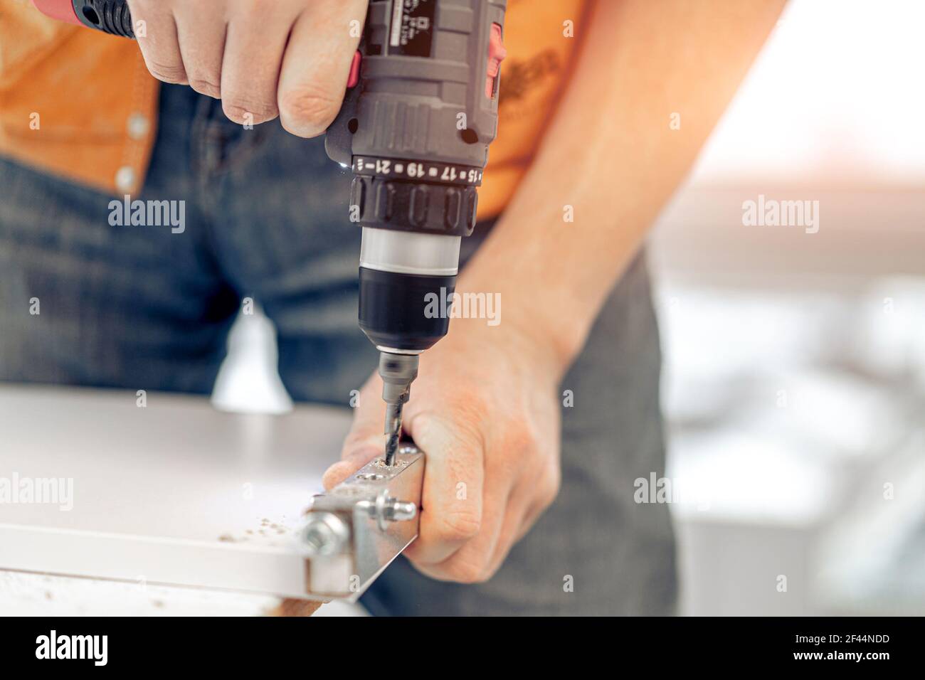 Man working during process of furniture manufacturing Stock Photo - Alamy