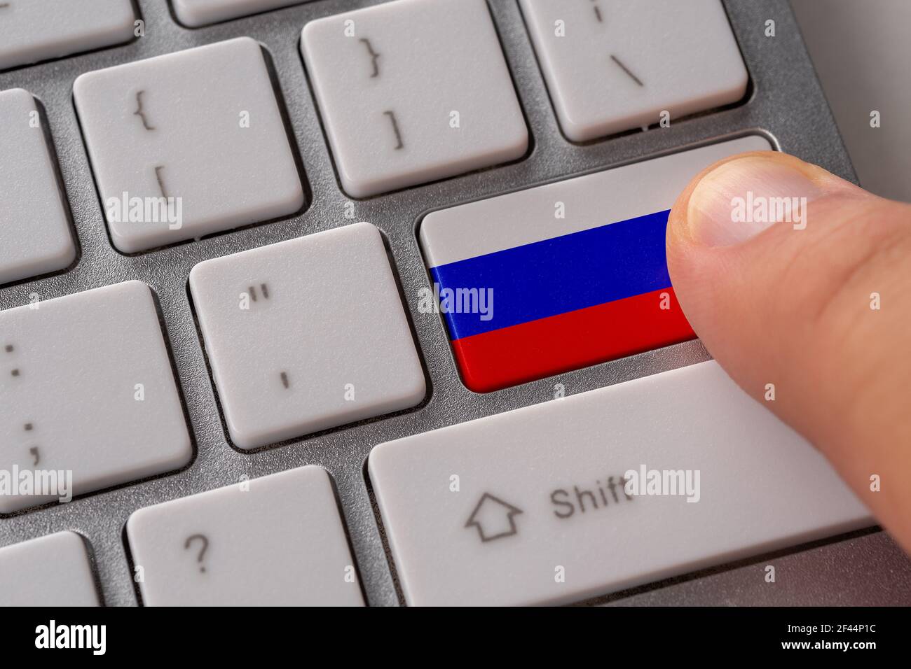 Male hand pressing keyboard button with flag of Russia on it. Online ...