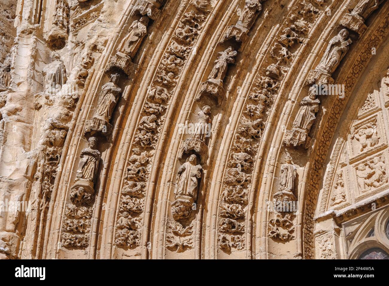 Decorative sculptures in the 'Puerta del Obispo' of the Cathedral of Palencia. Historic-artistic monument of Gothic style Stock Photo