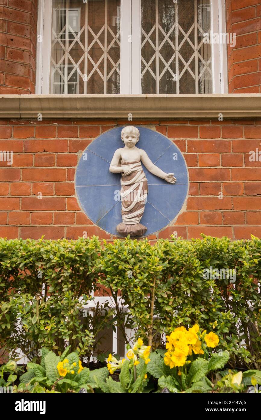 Ceramic tondi outside the former Westminster Children's Hospital, Infants Hospital, Udall Street, Westminster, London, SW1, UK Stock Photo