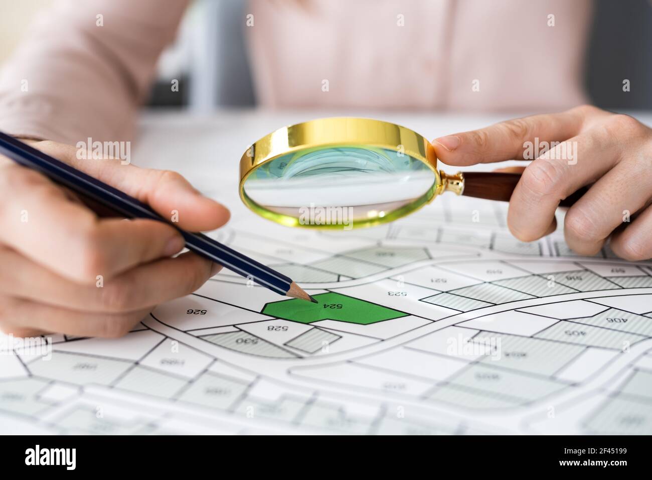 Glass Over Land Map Planning And Development Paper Stock Photo