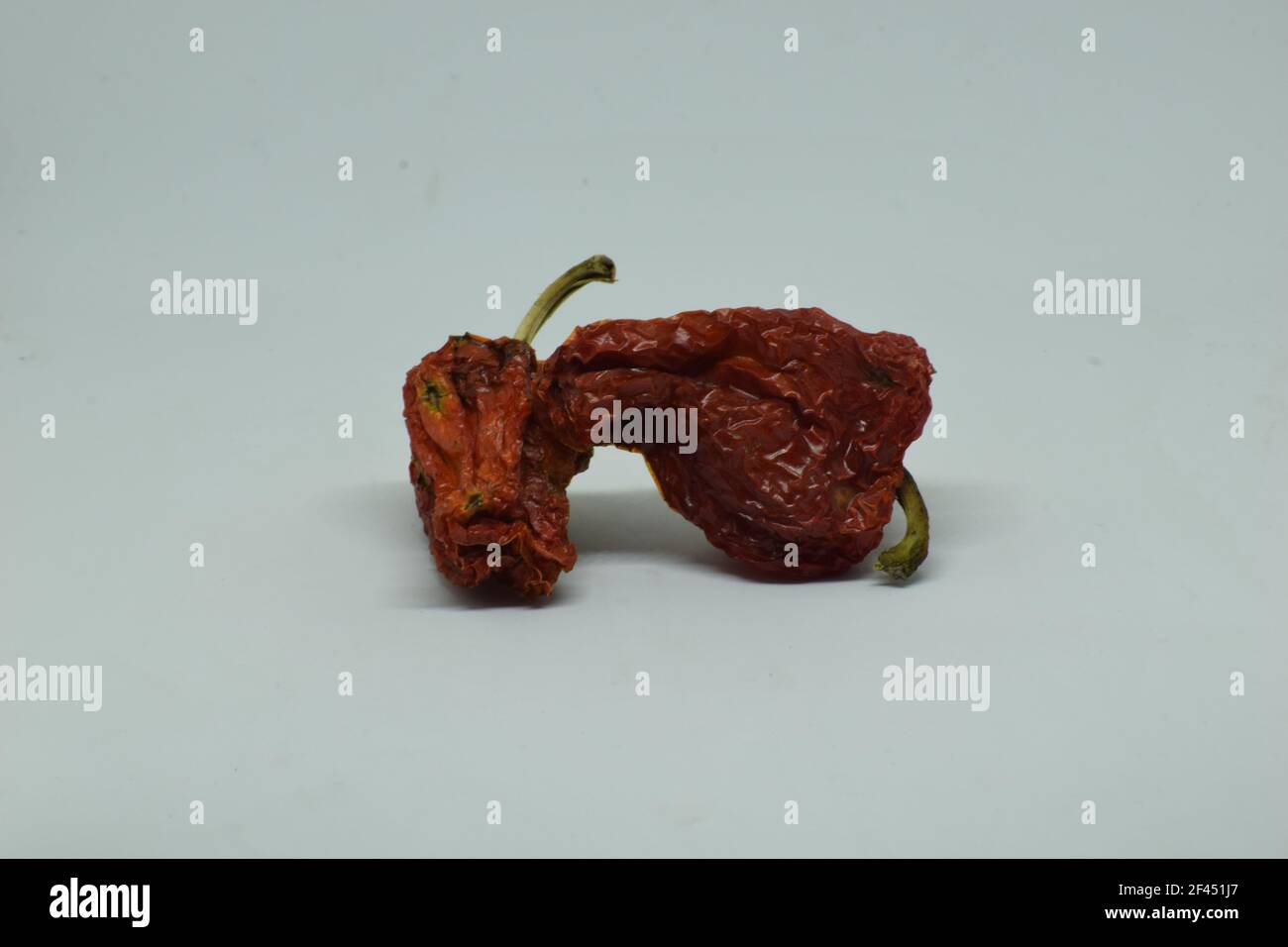 The dried red peppers isolated on a white background Stock Photo - Alamy