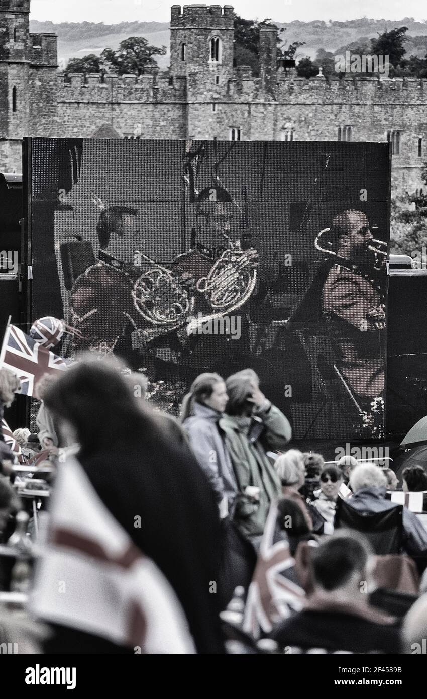 Large digital screen display at an outdoor summer concert at Leeds Castle. Kent. England. UK Stock Photo
