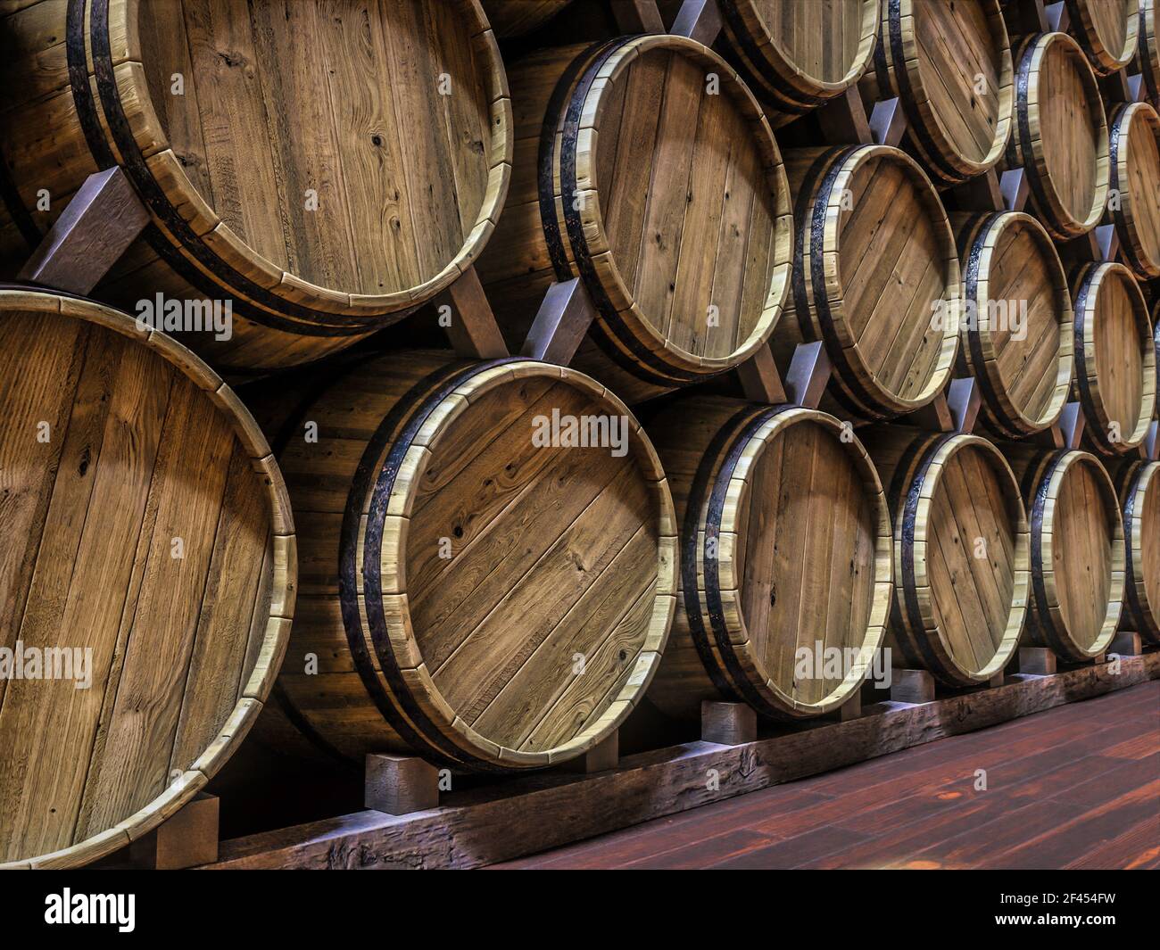 Vine cellar with oak barrels stacked in rows Stock Photo Alamy