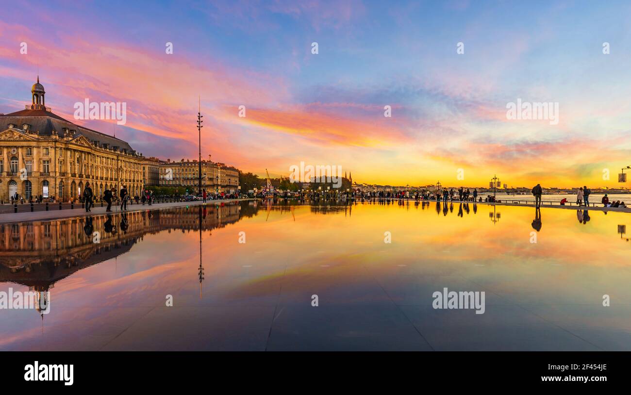 The water mirror, Place de la Bourse in Bordeaux at sunset, Gironde, New Aquitaine, France Stock Photo