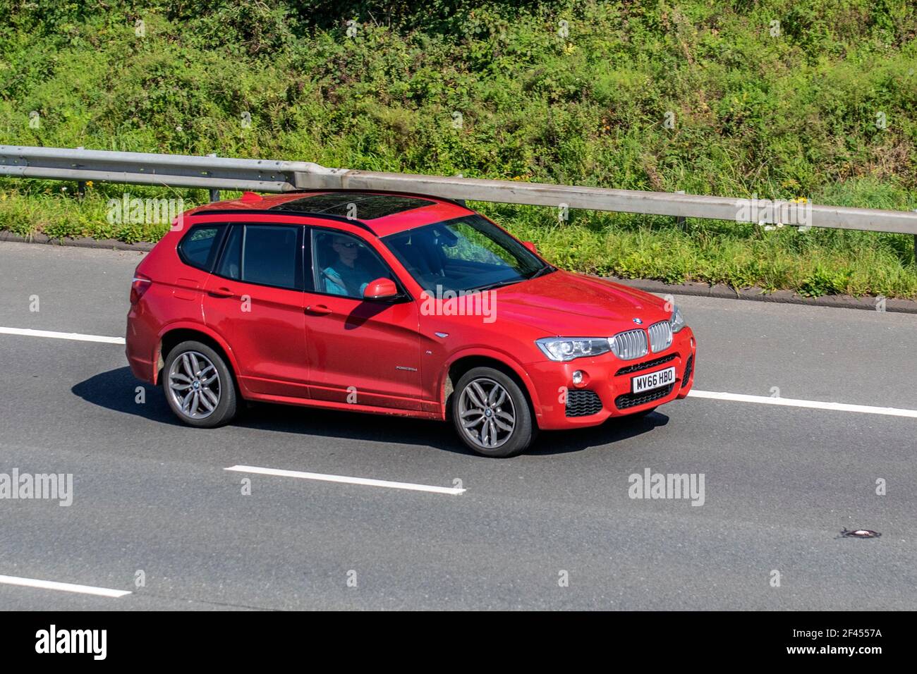 2016 red BMW X3 Xdrive35d M Sport Auto 2993cc diesel SUV; Vehicular traffic, moving vehicles, cars, vehicle driving on UK roads, motors, motoring on the M6 motorway highway road network Stock Photo
