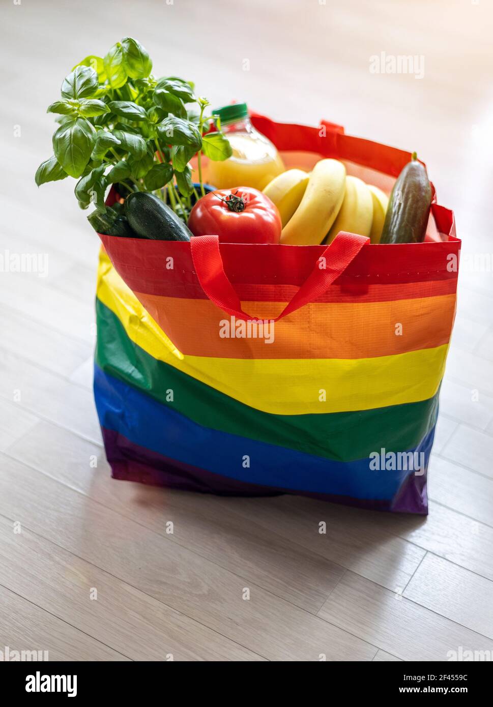 Colorful grocery bag filled with food Stock Photo
