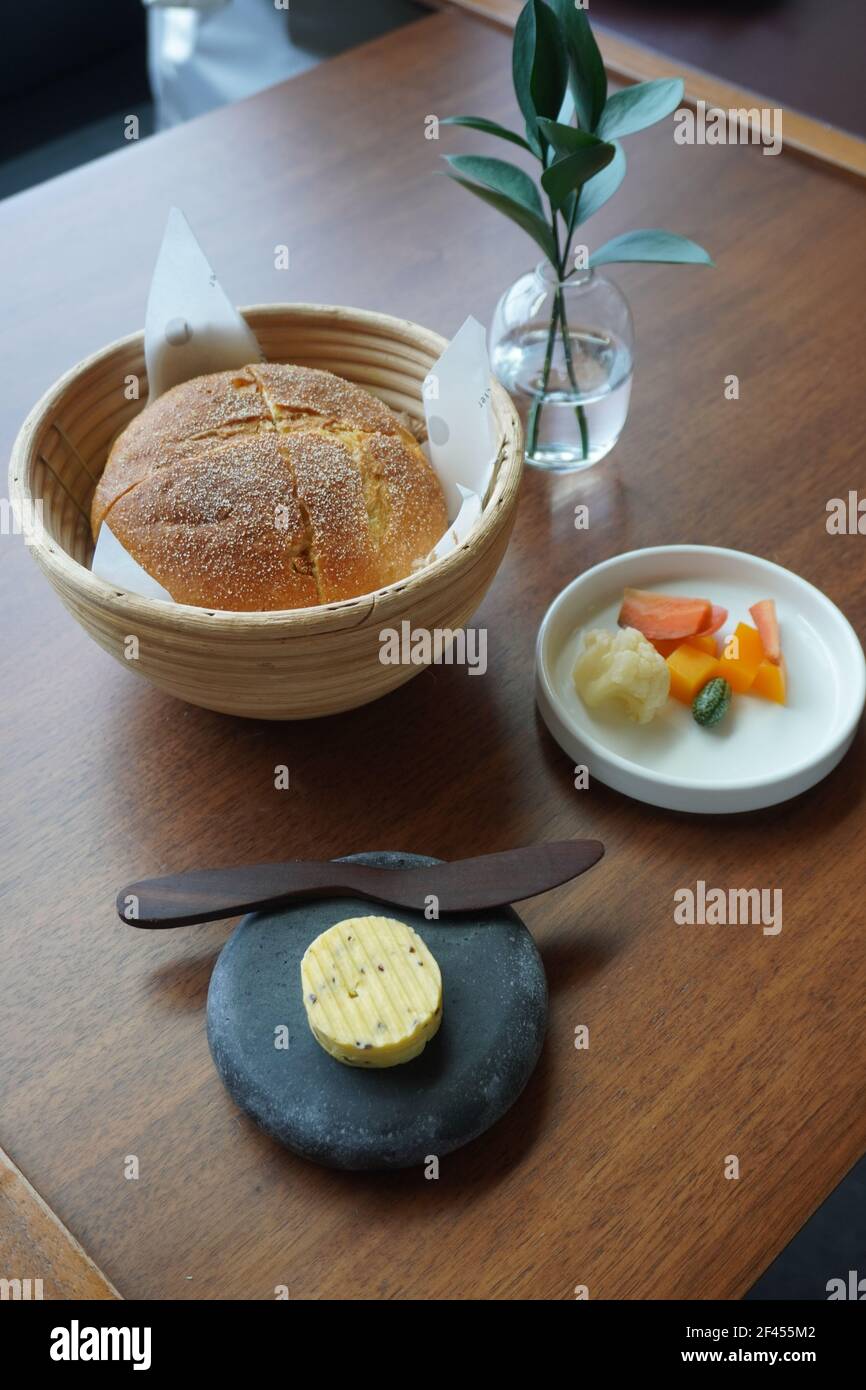 House-made Corn Bread, Kombu Butter, Pickles, Amuse Bouche Stock Photo