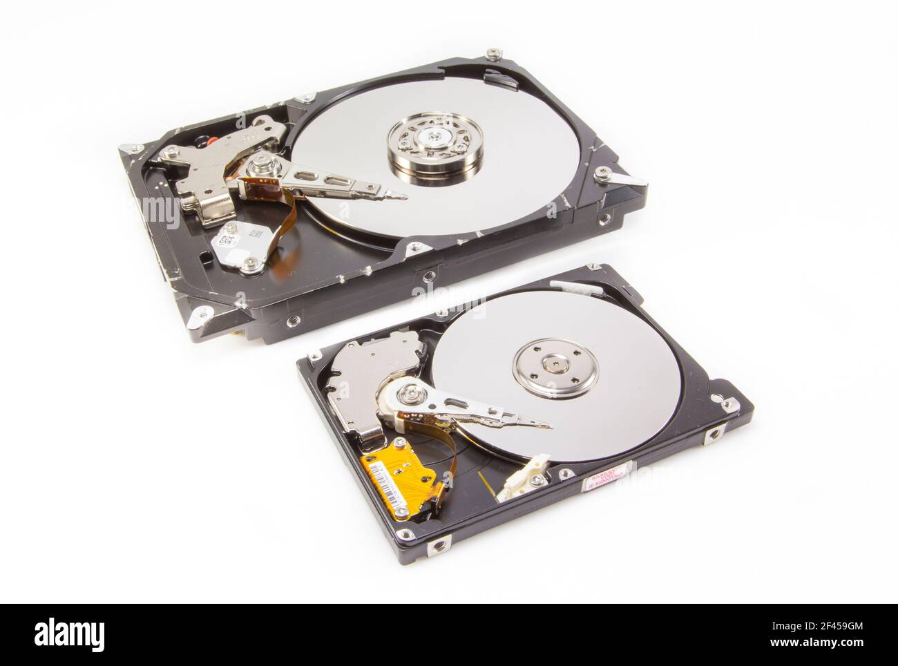 Two different size hard drives showing interior over white background Stock Photo Alamy