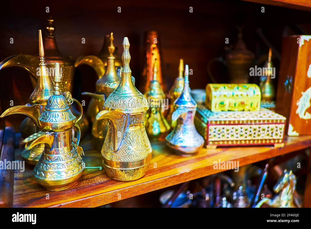 The dallah coffee pots, covered with intricate carved patterns in stall