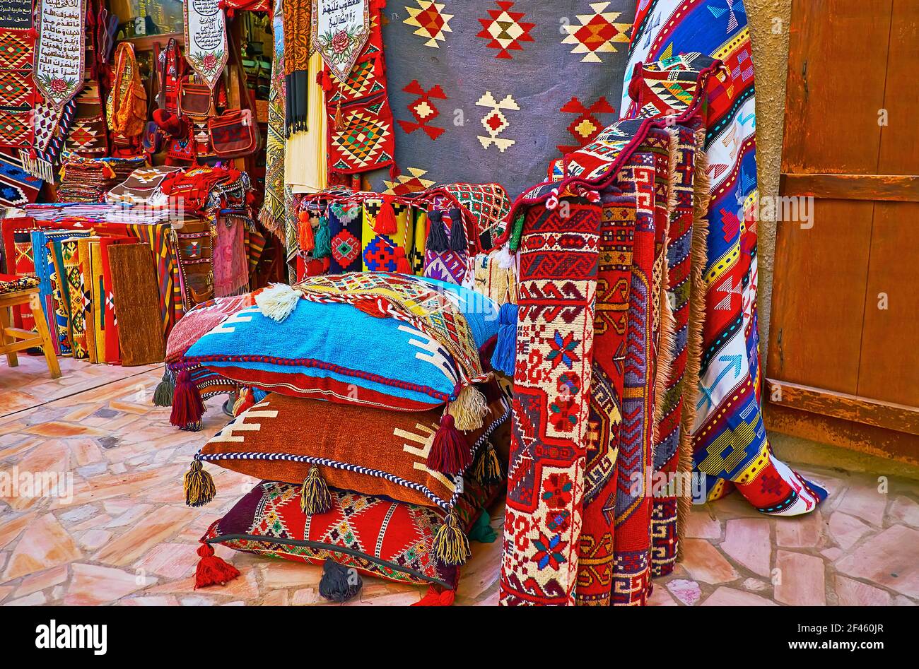The colorful carpets, rugs, pillow cases andtapestries in stall of Al