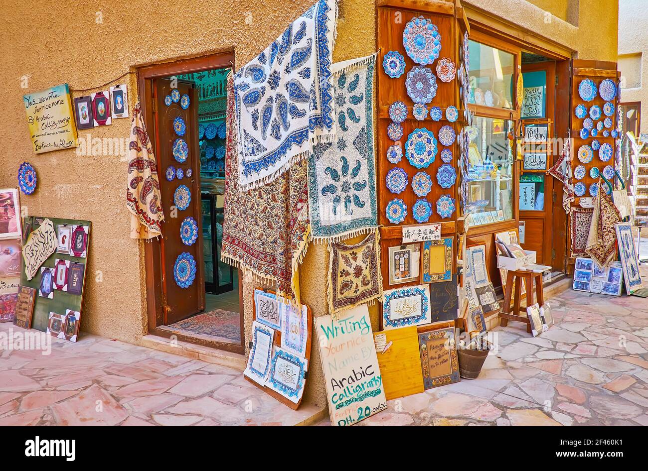 The souvenir shop offers impressive Iranian handicrafts - block-printed cotton ghalamkar tapestries and turuoise minakari pottery, Al Souk al Kabir (O Stock Photo
