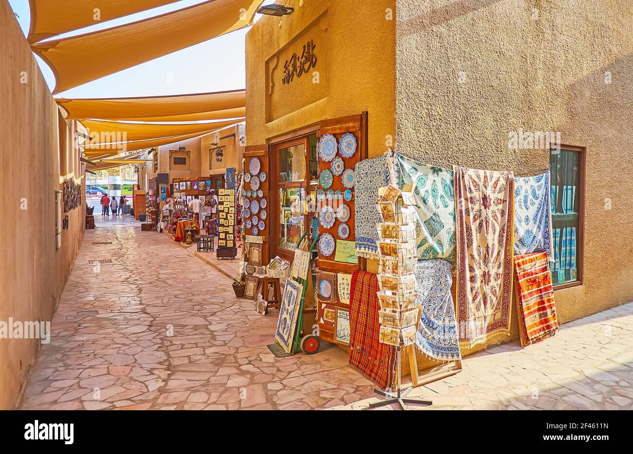 The scenic cotton textiles, decorated in ghalamkar block-printing technique, minakari potteri and many other items in souvenir store of Al Souk al Kab Stock Photo