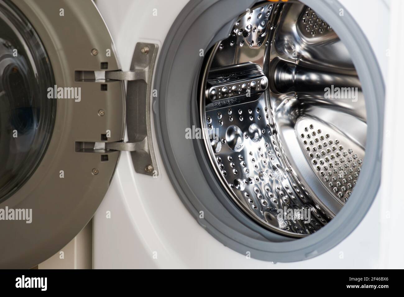 Wide open washing machine door macro close up view Stock Photo Alamy