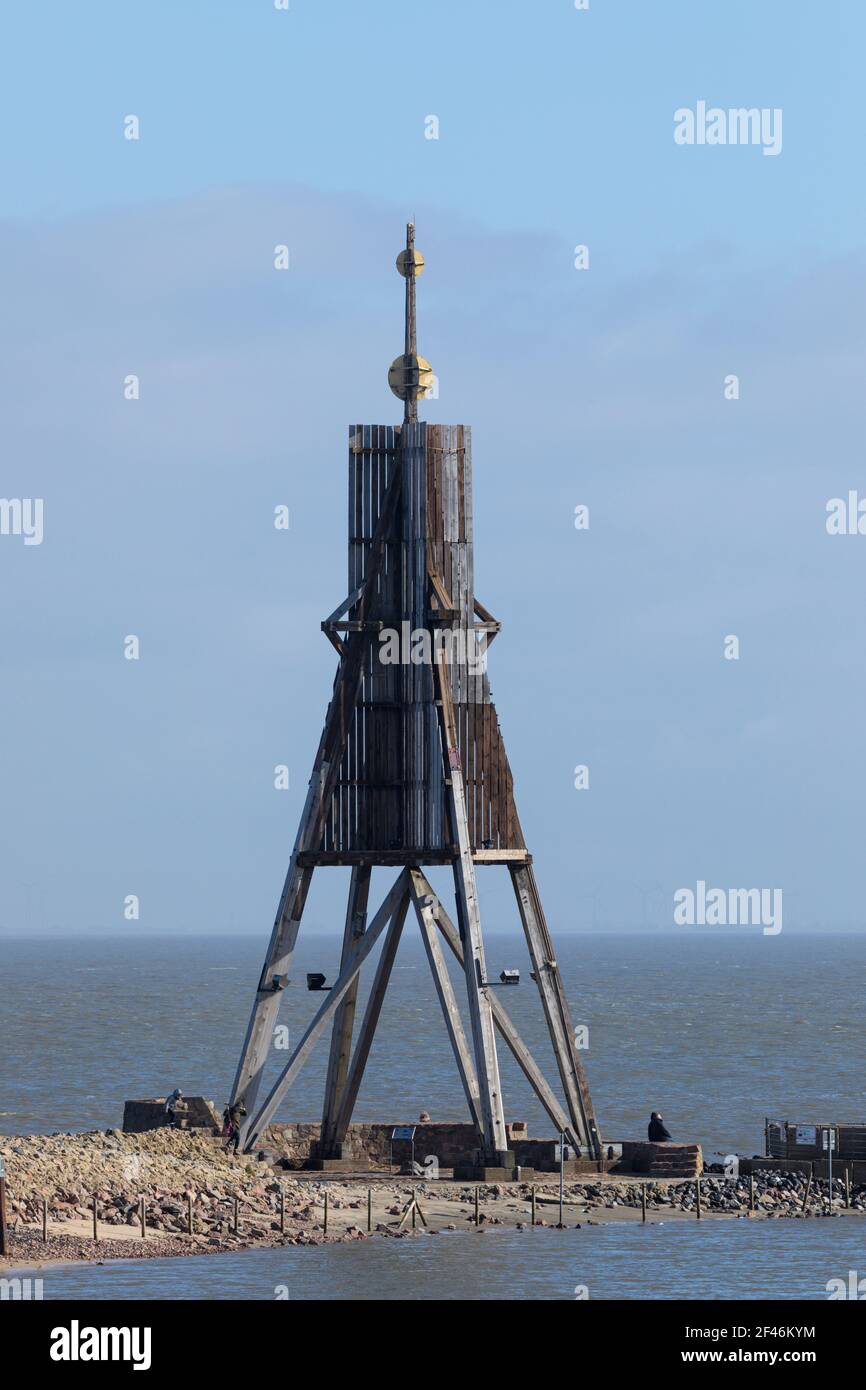 Kugelbake or Ball Beacon, landmark of the city of Cuxhaven on Elbe river estuary, tourists visiting the place. Stock Photo