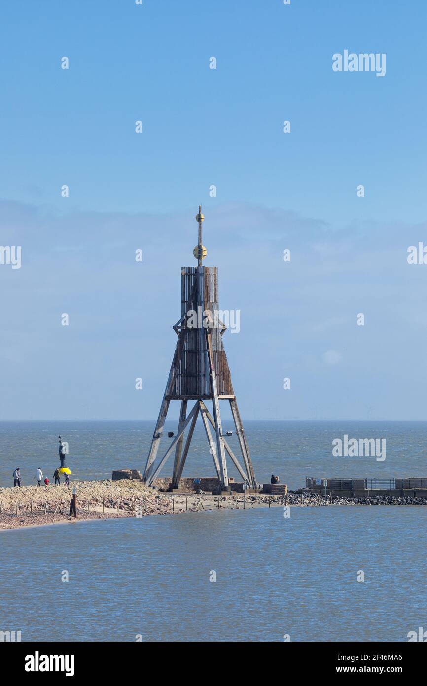 Day-trippers visiting Ball Beacon (Kugelbake), landmark of the city on Elbe river estuary. Stock Photo