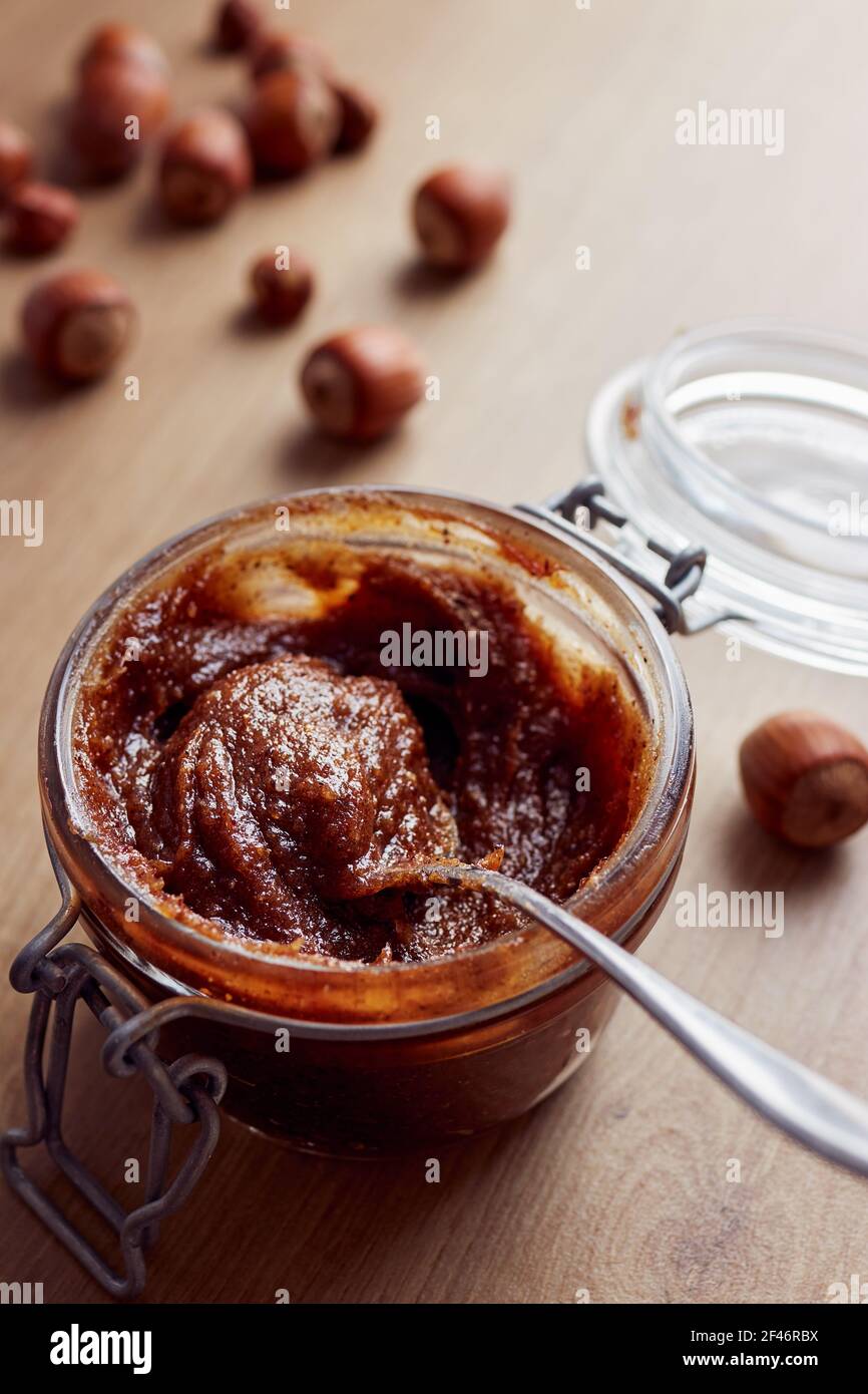 Jar of homemade chocolate hazelnut date spread Stock Photo