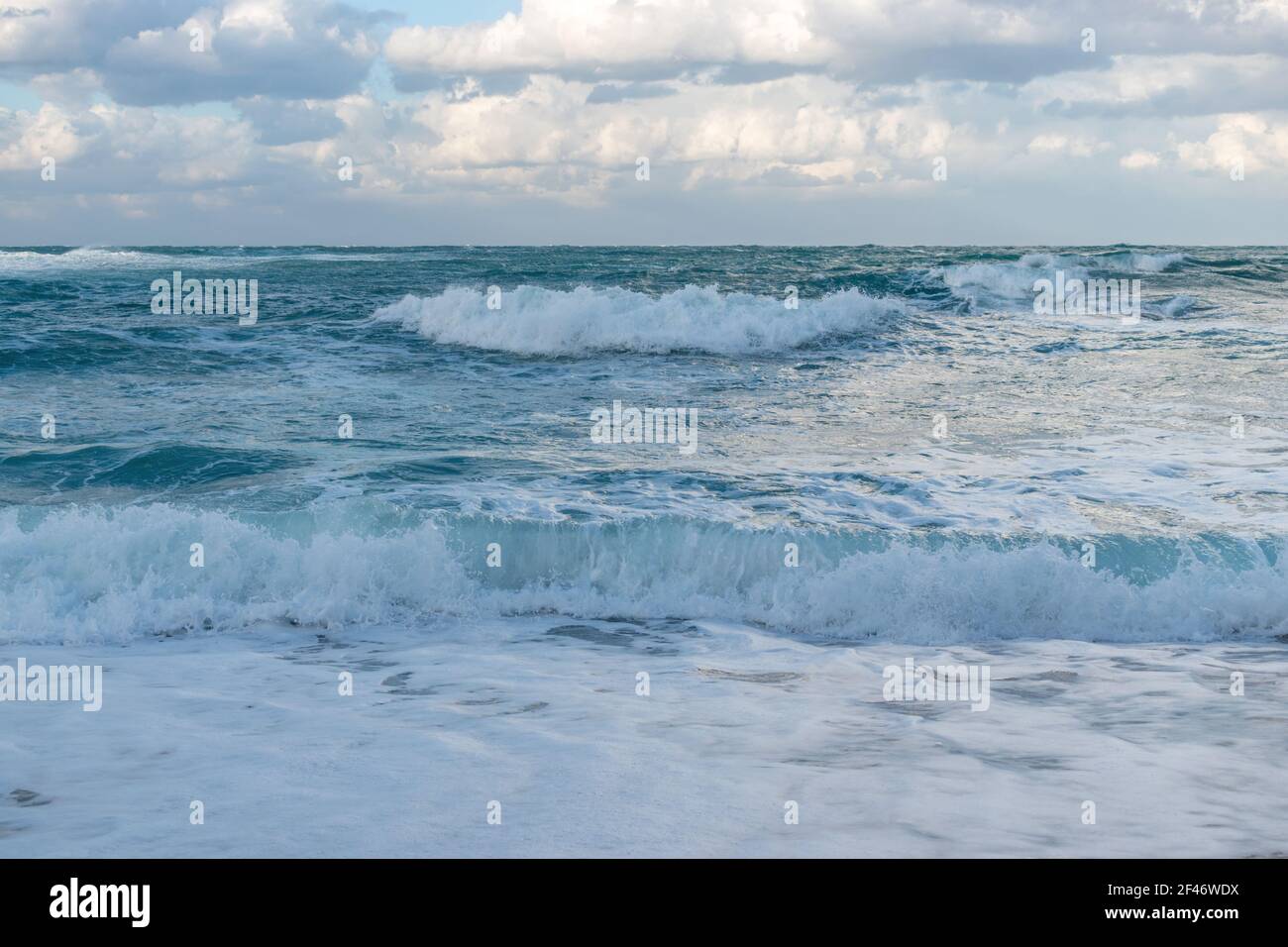 Blue sea with waves and sky with clouds before storm Stock Photo - Alamy