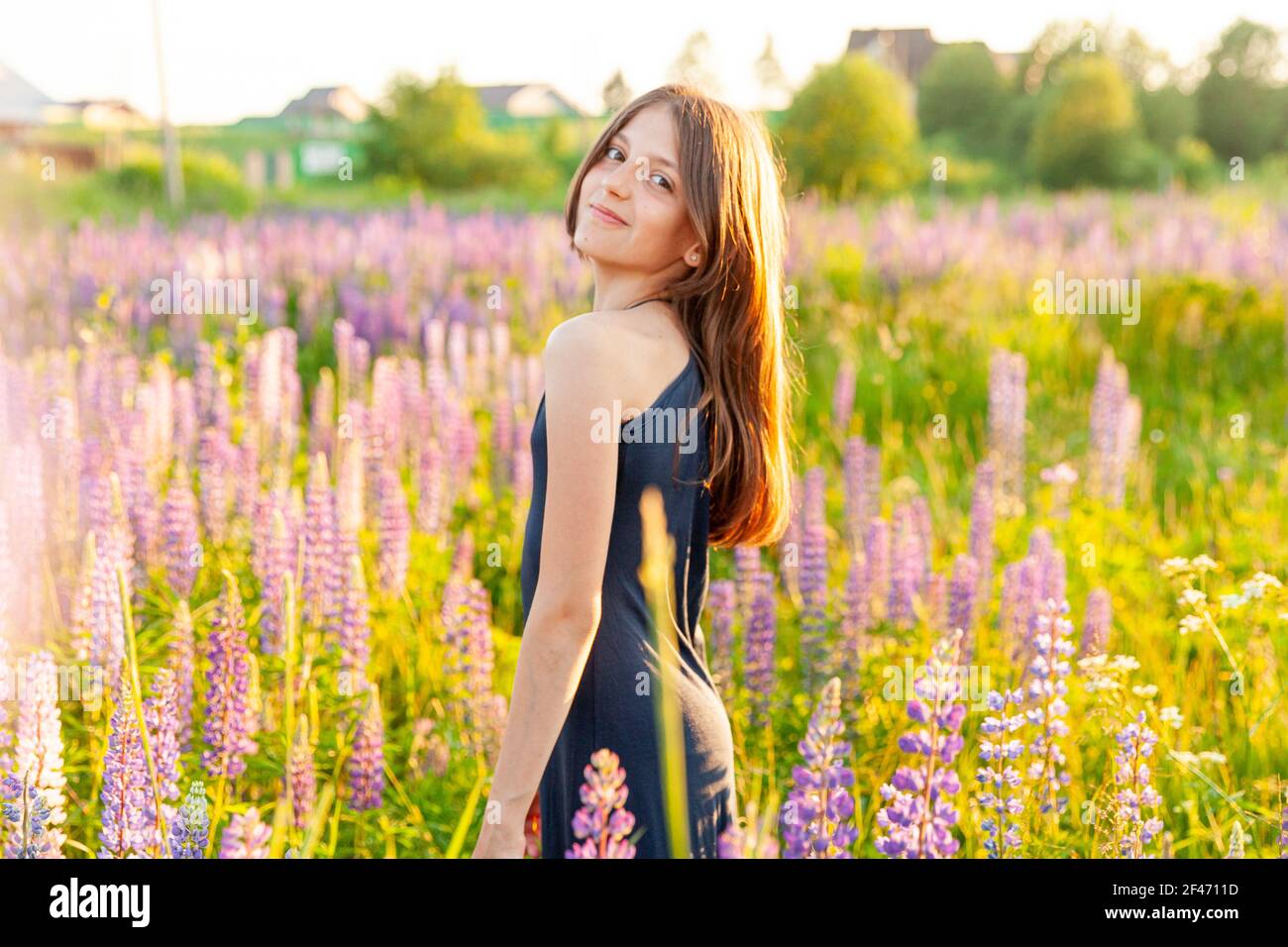 Happy teenage girl smiling outdoor. Beautiful young teen woman resting