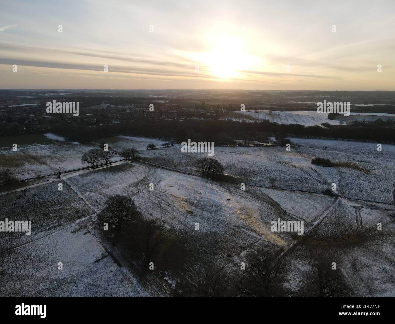 Snow covered fields in Essex UK at sunrise aerial image Stock Photo