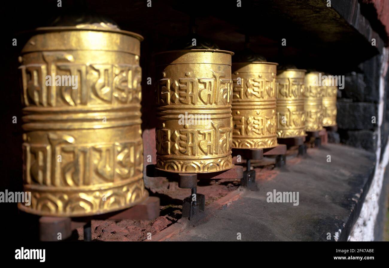 golden buddhist prayer wheels Stock Photo Alamy